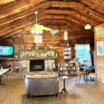 log cabin all wood interior with fireplace and vaulted ceilings