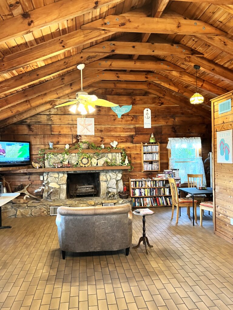 log cabin all wood interior with fireplace and vaulted ceilings